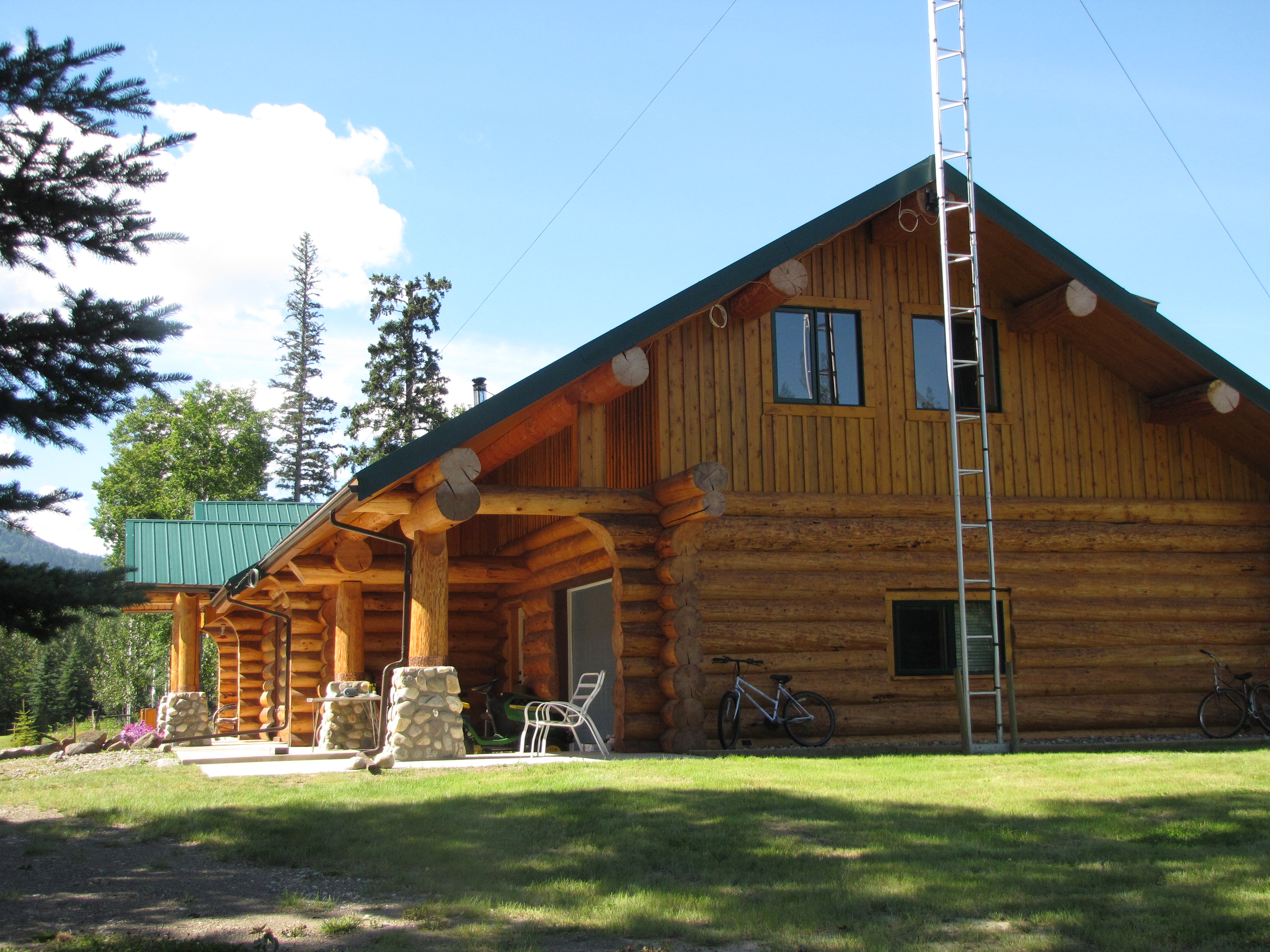 Private: 276 Cowie Creek Road >Chetwynd | Wildlife Paradise 126 Forested Acres | Log Home with Rock Fireplace | Garage and Workshop | Log Guest Cabin